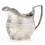 A George III silver cream jug, reeded handle and rim, initialled A, 85mm h, maker I M, probably John