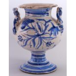 An Italian maiolica vase, 19th c, of bulbous form with waisted neck and twisted shoulder-handles,