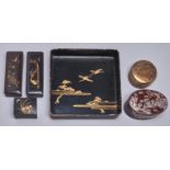 A Chinese mother of pearl inlaid oval wood box and cover, three Japanese lacquer boxes and covers,