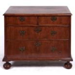 A George II walnut chest of drawers, the quarter veneered top with ovolo lip above two short and two