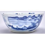 A Chinese blue and white export porcelain punch bowl, 19th c, painted with a continuous river