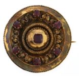 A Victorian garnet brooch, c1880, in gold, locket back, 11.7g Light wear consistent with age,