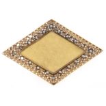 A lozenge shaped gold brooch with seed pearl surround, 4.8g Slight wear and some dents on reverse