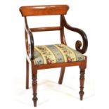 A Victorian mahogany elbow chair, c1850, with scroll arms, padded floral woolwork seat and turned