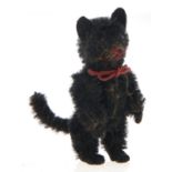 A Schuco miniature mohair black cat, with felt ears and paws, 63mm h approx A well preserved example