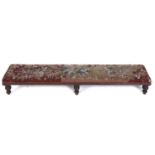 A Victorian walnut hearth stool, the padded top covered in contemporary floral wool and beadwork,