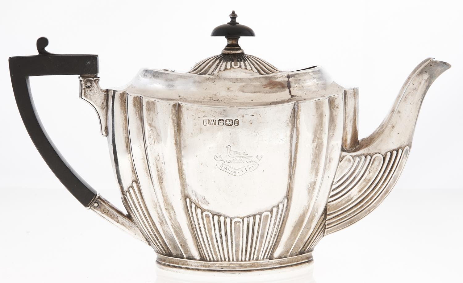 A Victorian silver teapot, of fluted oval shape, crested, 13.5cm h, by Lee & Wigfull, Sheffield