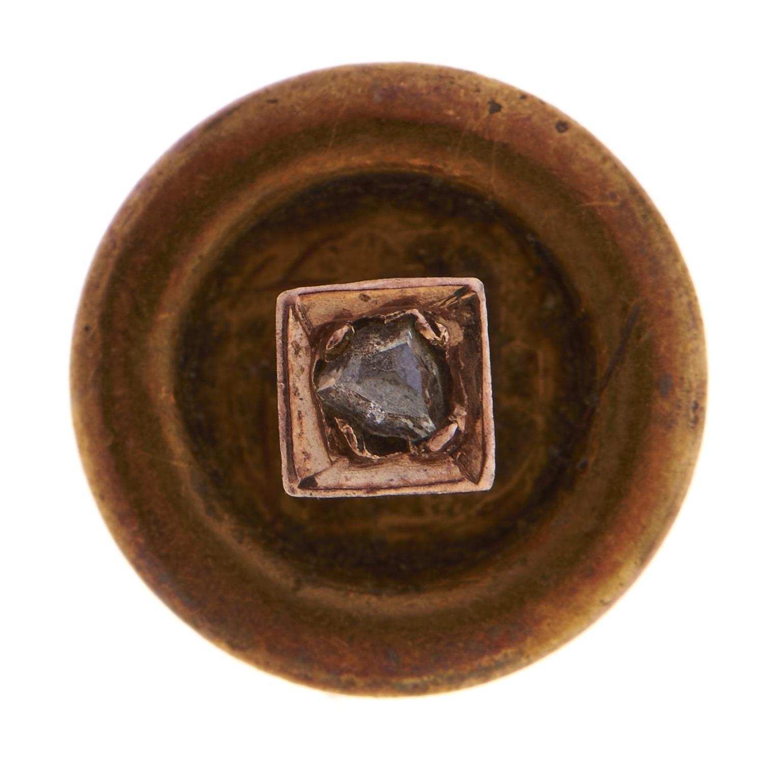 A diamond stud, in gold, marked 15ct, 1.1g