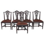 A set of five George III mahogany dining chairs, early 19th c, with vase centred splat on moulded