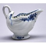 A Lowestoft blue and white dolphin ewer, c1765, painted with trailing flowers in sprigs, 75mm h Good