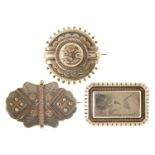 Three Victorian aesthetic and other contemporary silver brooches, two unmarked, the third by David &