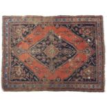 An antique rug - 145 x 198cm Localised wear