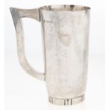 An Elizabeth II modernist silver mug, raised from the flat, hammer textured, on fluted ring foot,