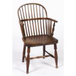 An ash and elm low back Windsor elbow chair, mid 19th c, railed back, dished seat on turned legs