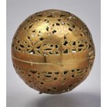 A spherical brass incense burner, pierced and engraved with birds amidst scrolling foliage,