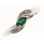 An emerald and diamond ring, in white gold marked 750 18k, 3.1g, size N Good condition