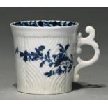 A Worcester blue and white coffee can, c1755-1757,  with ornate C scroll handle, painted with the
