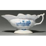 A Worcester blue and white sauceboat, c1755, of press moulded, wavy edged and high footed form,