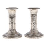 A pair of Edwardian dwarf silver candlesticks, 90mm h, by Levi & Salaman, Birmingham 1908, loaded