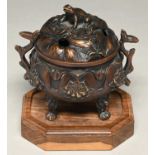 A Chinese bronze tripod vessel and cover, with toad finial and cast with lotus and leaves, 12cm