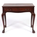 A George III mahogany side table, on cabriole legs with claw and ball feet, 71cm h; 45 x 84cm Old
