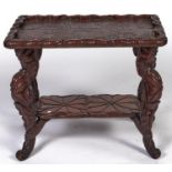 A Japanese naturalistically carved and stained softwood table, Taisho period, of lotus leaves,