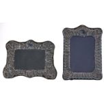 Two Elizabeth II silver photograph frames, in Victorian style, with embossed mount backed on velvet,