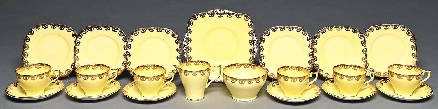 A J H Cope Wellington china yellow ground tea service, second quarter 20th c, printed mark (21) Good