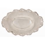 An Edwardian silver fruit dish, with die stamped and pierced border to the widely everted rim,