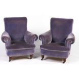 A pair of late Victorian armchairs, c1900,  on turned walnut feet with pottery castors, seat