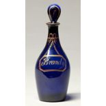 An English cobalt glass club decanter and stopper, early 19th c, with gilt Brandy label, 25cm h