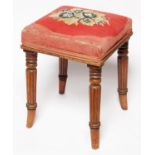 An early Victorian mahogany stool, c1850, the square top upholstered in beadwork and gros point with