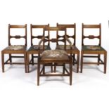A set of five George III fruitwood dining chairs, c1800, the concave top rails mahogany strung above