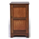 An Edwardian mahogany cabinet, early 20th c, the rectangular top above a twin panelled door, 60cm w,