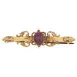 A garnet cabochon bar brooch, in gold, unmarked, 3.5g Pin possibly associated