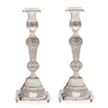 A pair of  George V silver candlesticks, nozzles,  27cm h, by Rosenzweig, Taitelbaum & Co, London