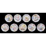 A set of nine Nove maiolica plates, early 20th c,  boldly painted with tulips, pansies and