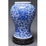 A Chinese blue and white vase, painted with peony and floral meander, 26.5cm h, concentric circles