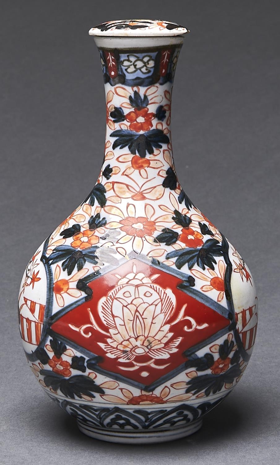 A Japanese Imari bottle and stopper, 19th c, 23cm h Stopper damaged. Bottle with short crack in