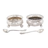 A pair of Victorian silver salt cellars, with crimpled rim, on ball feet, 50mm diam, maker's mark