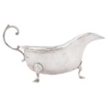 A George V silver sauceboat, with flying scroll handle, 18cm l, by Barker Brothers, Chester 1917,