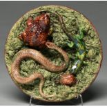 A Portuguese Palissy ware dish, M. Mafra, late 19th c, applied with a snake and lizard, each