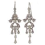 A pair of diamond chandelier earrings, with pear shaped diamond drop, mounted in white gold coloured