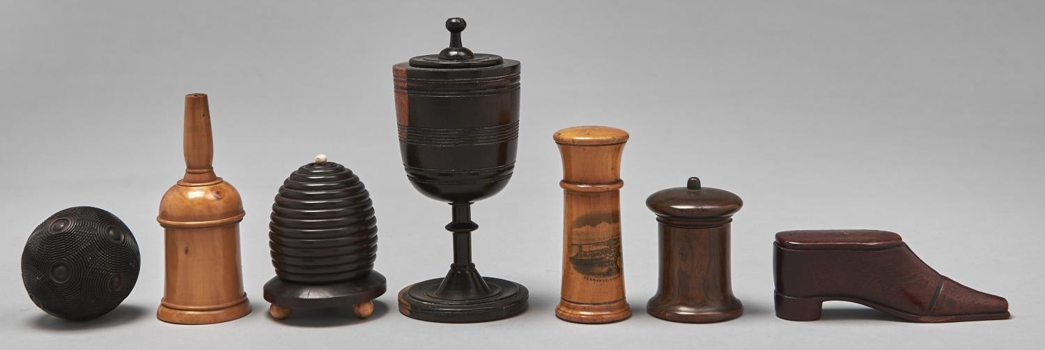 Treen. A Lignum Vitae cup and cover, Victorian sycamore glover powderer, a Victorian fruitwood
