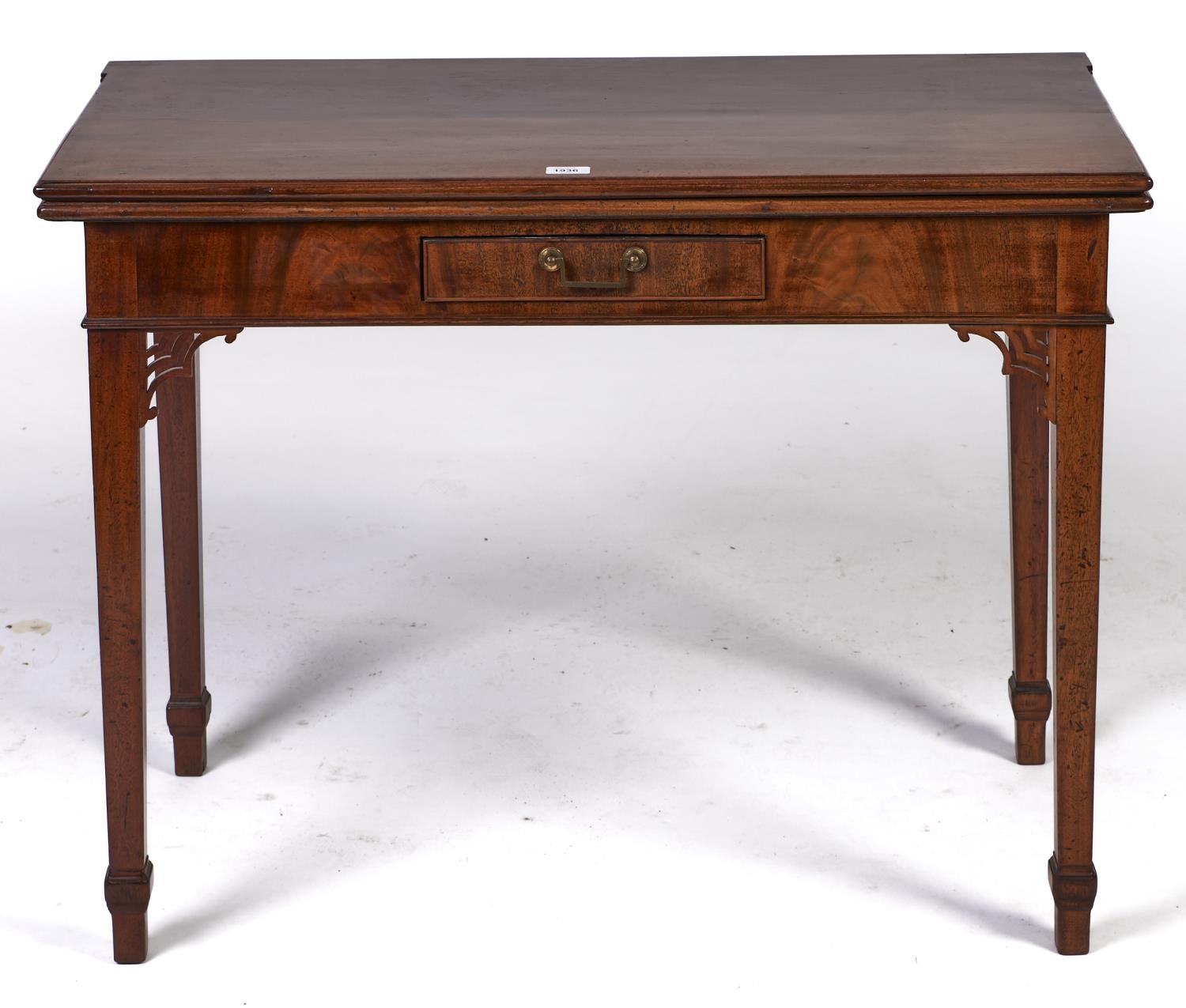 A George III mahogany tea table, c1800, the rectangular top with ovolu moulded lip, figured frieze