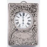 A Victorian silver mounted leather folding timepiece, the die stamped mount with garden scene,