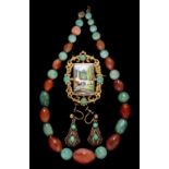 A necklace of jade and cornelian beads, 36cm l, a giltmetal brooch set with a porcelain plaque