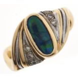 An ammolite and diamond ring, in gold marked 750, 7.g, size P Ammolite scratched