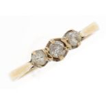 A three stone diamond ring, in 9ct gold, 1.3g, size I Much dirt and slight wear