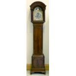 An Edwardian eight day mahogany longcase clock, early 20th c, the 10" breakarched brass dial with